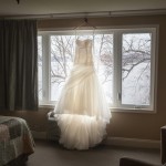 brides-dress-hangs-in-window